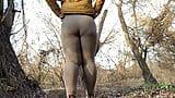 MILF with big butt covered in leggings gives a plentiful golden shower outdoors snapshot 10