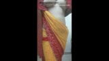 Aunty taking off yellow saree snapshot 4