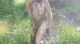 NUDE MAN PLAYING IN MUD snapshot 13