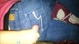 Woman jerking off man on her jeans snapshot 2