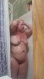 Blonde taking hot shower snapshot 3