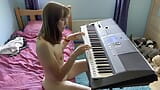 Playing the keyboard in the nude snapshot 3