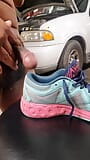 at the auto shop playing with Asics tennis shoes I found in customer SUV snapshot 6
