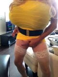 Busty smoking crossdresser in yellow snapshot 16