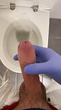 Jerking doctor at a toilet with latex gloves snapshot 8