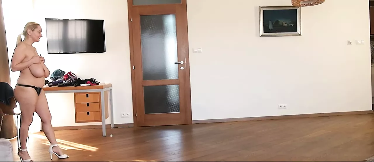 Natasha walks in white heels on widescreen