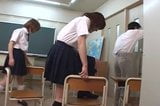 Two Japanese school girl spitting on teacher snapshot 3