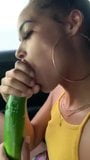 A women eating a cucumber snapshot 5