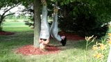 Two girls duct tape mummies outdoors snapshot 10