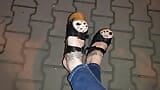 a crossdresser with amazing feet walks on the street in high heel wedges and tight jeans and tempts guys snapshot 15