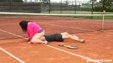 Obese woman facesits on her trainer at the tennis court snapshot 3