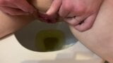 She pees in the toilet and touches her pussy snapshot 8