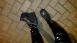 a crossdresser in high wedge platform shoes and latex leggings is walking the streets at night snapshot 2