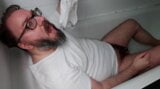 Chastity locked bear pisses his clothes and over himself snapshot 3