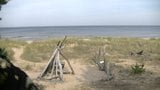 blonde looks at the sea in a special place on the dunes of K snapshot 10