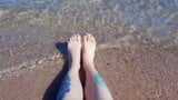 Dominatrix Nika enjoys the salty sea on her feet. snapshot 5