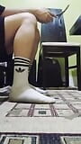 Cute twink showing his dirty white socks, while he listening to music and singing. snapshot 10