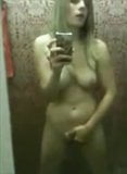 Amateur strips and masturbates in front of a mirror snapshot 7