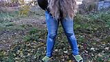 Pissed in jeans in a public park! Mature milf outdoors did not have time to take off her jeans and urinates right in the snapshot 8