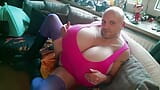 Huge tits Cup-Z crossdresser in a fetish outfit with boots massages and kneads his big breasts. Extremely large xl boobs in pink snapshot 1