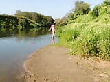 I'm posing on the riverbank in a white swimsuit snapshot 9