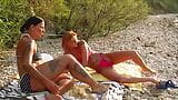 欲火中烧的德国女同性恋者在海滩上互相假阳具 snapshot 8