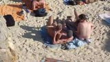 Group of guys having sex on the beach snapshot 5