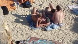 Group of guys having sex on the beach snapshot 6