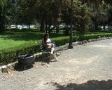 Maryely, while relaxing comfortably on a comfortable park snapshot 1