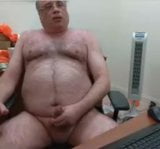 Webcam hairy bear daddy jerks his load on his desk snapshot 3