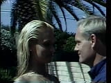 Blonda țâțoasă este futută pe un scaun de pe punte lângă piscină după ce face sex oral snapshot 5