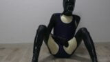 Latex dog crossdresser wearing latex catsuit and swimsuit snapshot 9