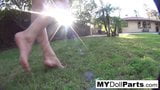 Kayla takes a barefoot walk around her backayard snapshot 4