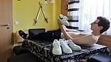 Young boy having fun at the dining table with sneakers snapshot 3