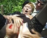 Wild German lady gets fucked by three hard and loaded cocks outdoors snapshot 12