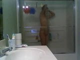 Girl in glass taking a shower snapshot 3