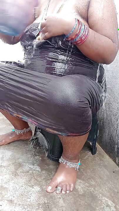 Tamil wife bathing in outdoor