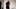Breitgürtel-Fetischdame zeigt ihren breiten Gürtel im Wetlook-Kleid