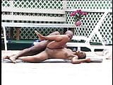 O negresă sexy își atinge pizda tânără înainte de a fi penetrată de negru lângă piscină snapshot 17