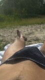 Crossdresser sunbathing in Thong snapshot 2