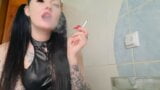 Dominatrix Nika smokes.  Smoking fetish.  Cigarette smoke from the mouth of a charming Mistress right on your face. snapshot 5