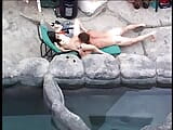 Dude devours brunette's young soft pussy and plows her next to hot tub snapshot 5