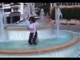 Marjorie is getting wet in a public fountain - outdoor snapshot 7