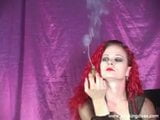 Redhead Melissa smokes a cigar while teasing us snapshot 3