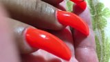 Latina with sexy long orange nails fingernails snapshot 5