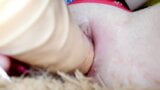 A big dildo goes in and out of a tight and wet pussy snapshot 5