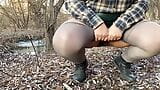 Pissing curvy MILF in skirt and pantyhose outdoors snapshot 5