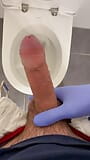 Jerking doctor at a toilet with latex gloves snapshot 3