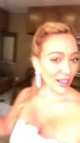 HIlary Duff cleavage in a fancy dress, selfie snapshot 3