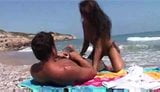 Interracial couple on the beach snapshot 4